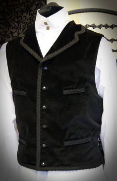 Velvet Dr Who waistcoat with braid trim by Obsidian Gothic, great for 11th Dr cosplay, steampunk or gothic style. Check out the Obsidian Gothic Clothing shop for shirts to go with this style. The waistcoat is made from cotton velvet & is fully lined & backed in satin. There is a full collar and 4 pockets at the front waist & chest. The waistcoat fastens with ornamental buttons (buttons may vary from those shown). Black braid trims the collar, top front, bottom edges & pocket welt Vintage Sleeveless Vest For Costume Party, Sleeveless Buttoned Vest For Costume, Gothic Sleeveless Vest For Costume Party, Fitted Gothic Vest For Halloween, Gothic Black Vest For Costume Party, Gothic Vest For Halloween Costume Party, Gothic Vest For Halloween Cosplay, Black Vest For Halloween Costume, Fitted Gothic Vest For Winter