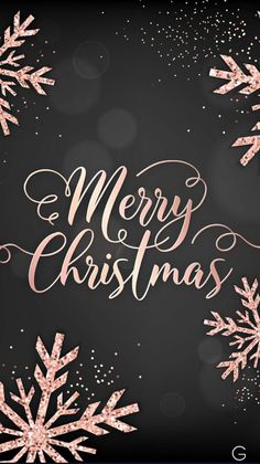 a merry christmas card with pink snowflakes and sparkles on a black background