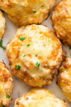 keto cheese drop biscuits with parsley on top and the words keto cheese drop biscuits no yeast, no grains, low carb