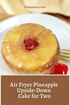 an air fryer pineapple upside - down cake for two on a white plate