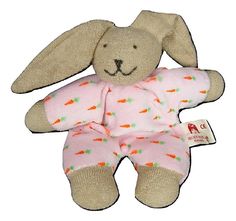 a stuffed rabbit with carrots on it's body