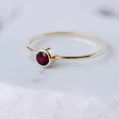 Ruby Ring, Ruby Gold Ring, Dainty Gold Ring, Stacking Gold Ring, 14K Gold Ring, Simple Stone Ring, Gold Bezel Ring, July Birthstone RingA modern and timeless 14K gold ring with a natural Ruby gemstone. A perfect gold ring for women, stacking and minimalist that adds glam to every outfit. 100% handcrafted with love!D E T A I L S● Metal: 14K solid gold, 14K white gold or 14K rose gold● Gemstone: Ruby● Stone Diameter: 3.3mmR I N G ∙ S I Z I N GFor General Reference:● we use standard US Ring Sizing● Gold Stackable Rings With Ruby Bezel Setting, Elegant Yellow Gold Stackable Rings With Round Stone, Elegant Yellow Gold Stackable Rings, Elegant Garnet Stackable Rings, Elegant Stackable Yellow Gold Ruby Ring, Elegant Stackable Birthstone Ring, Elegant Stackable Ruby Ring In Yellow Gold, Classic Ruby Jewelry With Round Stone, Elegant Garnet Ring With Bezel Setting