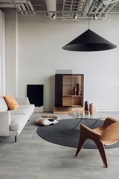 a living room filled with furniture next to a window