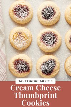 cream cheese thumbprint cookies with powdered sugar on top