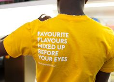 the back of a yellow t - shirt that says, favorite flavors mixed up before your eyes