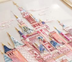 a close up of a castle made out of beads