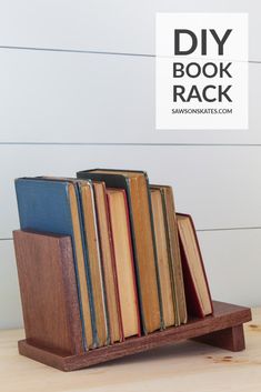 a wooden book rack with several books on it and the words diy book rack above it