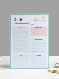 the daily planner is sitting on top of a desk