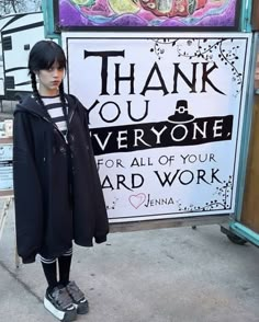 a person standing in front of a sign with words on it that say thank you everyone for all of your hard work