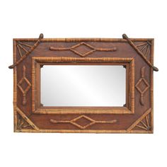 a mirror that is made out of wood and has bamboo sticks on the bottom of it