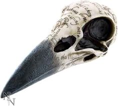 a black and white bird skull with writing on it's head is shown from the neck down