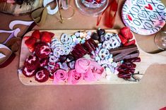 a table topped with lots of different types of candy and candies on top of it