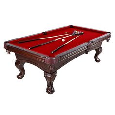 a red pool table with two cues and one ball resting on the cue's end