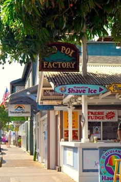 a small ice cream shop on the side of a street