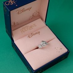 an open box with a ring in it