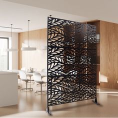 a room divider in the middle of a living room next to a dining room table