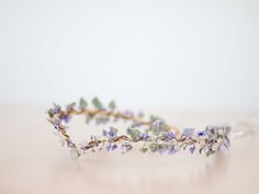 a close up of a flower crown on a table