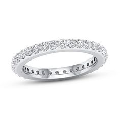 a white gold wedding band with round diamonds