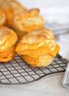 several pastries sitting on a cooling rack