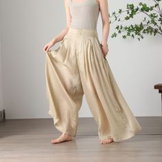 "Cool and comfortable for hot summer days, this apricot wide leg pants is elegant and stylish.    It is a wonderful wardrobe staple that's a timeless classic you'll wear again and again.  All our items are Tailored and Handmade and Made to Order ,I can make Any Size . I design new styles every week, please collect my store. I believe that you will meet your favorite styles. ★★FEATURES Tencel flax Has lining Two side pockets Front zipper closure Wide leg pants Apricot pants Casual pants Long pant Bohemian Summer Pants In Solid Color, Bohemian Summer Pants, Spring Summer Harem Pants With Relaxed Fit, Casual Beige Harem Pants For Summer, Beige Cotton Harem Pants For Summer, Baggy Summer Vacation Pants, Solid Non-stretch Summer Bottoms, Summer Vacation Baggy Pants, Summer Wide-leg Relaxed Fit Bottoms