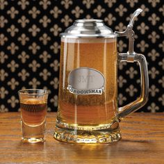 a beer mug and glass on a table