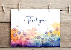 a thank card with watercolor flowers on it