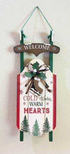 a welcome sign hanging from the side of a wall