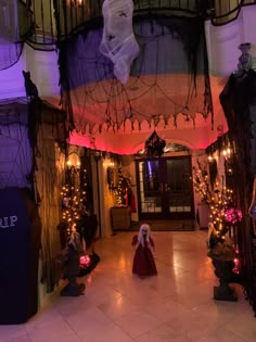 an indoor area decorated for halloween with lights and decorations