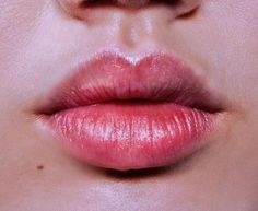 a woman's lips with pink lipstick on them