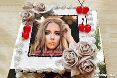 a birthday cake decorated with roses, cherries and an image of a woman's face