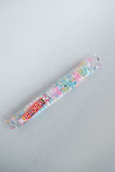 a candy bar with the word happy written on it's wrapper sitting in front of a white background