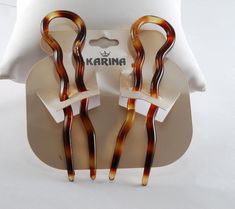 "For sale is a pair of vintage Hair forks. These hair forks are tortoise color plastic. The hair forks  measures  3/4\" x 3 1/2\". The hair forks are signed \"France\".  New Treasures added all the time. Check back often!" Fera Faucet Hair, Hair Forks, Best Clothing Brands, Tortoise Color, Hair Fork, Gift Inspo, Vintage Hair, Vintage Hairstyles, Hair Barrettes