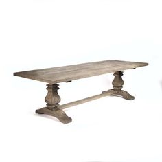 an old wooden table with two legs and a bench on the bottom, against a white background