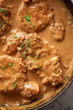 some meatballs and gravy in a pot