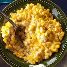 a green plate topped with macaroni and cheese