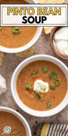 two white bowls filled with soup and topped with sour cream