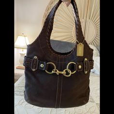 This Coach Vintage Bag Is Fabulous. It’s Very Soft Distressed Dark Brown Vachetta Leather. And The Large Belt Rings And Clap Are Great! What A Statement. This Handbag Has Never Been Used. The Size Is 13”W X 11”H And The Handles Drop 9”. 2001 Coach Purse Value, Coach Vintage Bag, Large Belt, Belt Ring, Vintage Coach Bags, Vintage Bag, Vintage Belts, Vintage Coach, Vintage Bags