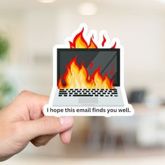 someone holding up a sticker with a laptop on it that says, i hope this email finds you well