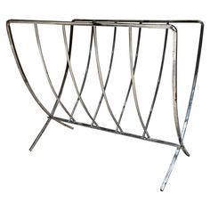 a metal rack with four sections on each side and one section at the top that is curved