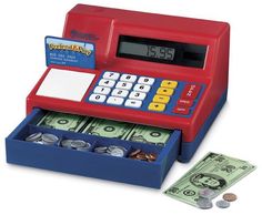 a red and blue toy cash register with money in it