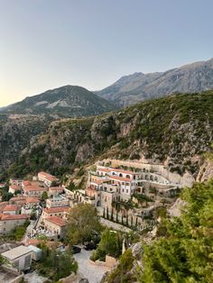 an aerial view of a village in the mountains