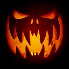 a carved jack o lantern with sharp teeth