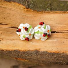 "These white flowers ladybug boho lampwork earrings is a perfect gift for woman. It's very tender and unique! Dimentions: diameter about 6/8\" inch (20 mm), see last photo for exact dimensions. Materials: artist lampwork beads, metal fittings. Colors used: white, light green, red. For your information: ✦ Get free shipping when you buy any two or more items! ✦ All jewelry is shipped with some kind of gift wrapping, box or bag depending on size. ✦ Your order will be packed very carefully and will Lampwork Flowers, Bug Earrings, Ladybug Earrings, White Flower Earrings, Boho Nature, White Flower Earring, Flowers Earrings, Miniature Food Jewelry, Kawaii Earrings