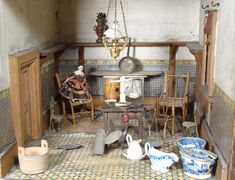 an old fashioned kitchen with lots of clutter on the floor and in the wall