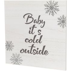 a wooden sign that says baby it's cold outside with snowflakes in the background