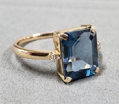 1. Blue Topaz & Diamond 18k Gold Ring 2. Made to Order 3. Gemstone - Blue Topaz, Diamond 4. Jewelry Type - Gold Ring 5. Total weight - 3.510 Gram Approx 6. Topaz Weight - 3.95 Carats 7. Gold Weight - 2.712 Grams Approx. 8. Diamond Weight - 0.04 Carats 9. Topaz Size - 8x10 MM 10. Gold Purity - 18k 11. Band Size - 1.70 MM 12. Handmade Items 13. AAA Quality Ring 14. Stackable Ring 15. 1 Quantity Available 16. Ready to dispatch in 1 - 2 days. 17. London Blue Topaz Pictures are taken under natura London Topaz Engagement Ring, Sapphire Gold Ring, Diamond Ring Gold, Gold Schmuck, Bijoux Art Nouveau, London Blue Topaz Ring, Gold Diamond Ring, Bling Rings, Stackable Ring