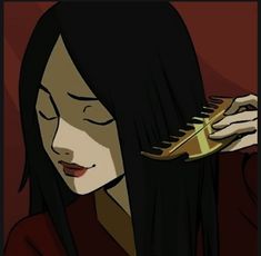 a woman with long black hair is holding a comb in her hand and looking down