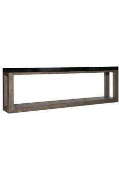 a large wooden shelf sitting on top of a white wall