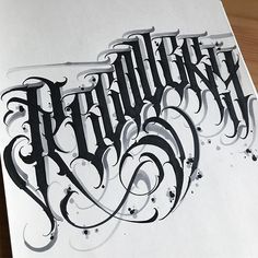 an artistically designed piece of paper with the words ink art written in black and white