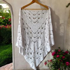 This beautiful crochet white shawl is the perfect gift for the special woman in your life. It's made with soft, lightweight material, making it perfect for a shoulder wrap or to drape around the neck. Crochet virus shawls are an eye-catching way to keep warm and cozy, and the intricate designs make them a unique and timeless piece. The handmade craftsmanship of this shawl ensures quality and durability, making it an ideal gift that can be enjoyed for years to come. With its impressive design and White Shawl, Crochet White, Shoulder Wrap, Wedding Shawl, Intricate Designs, White Crochet, Crochet Shawl, Beautiful Crochet, Gift Wedding